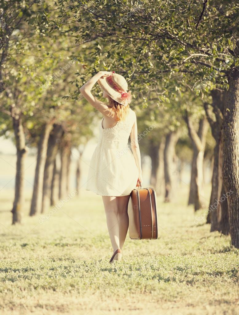 depositphotos_11798824-stock-photo-redhead-girl-with-suitcase-at